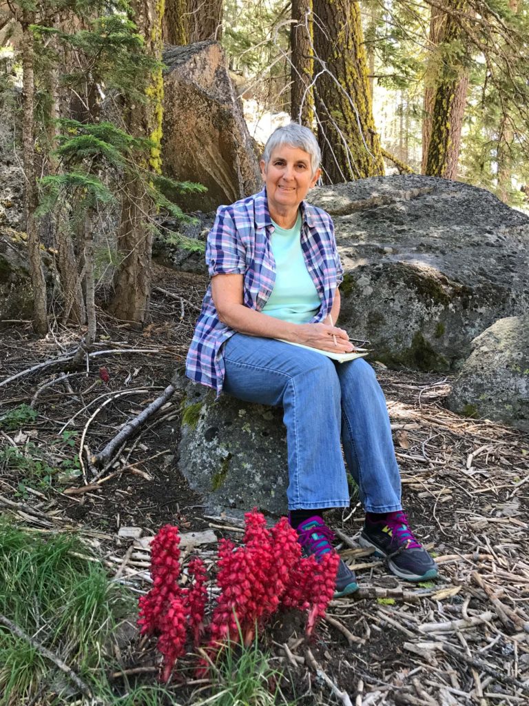 Susan Libonati-Barnes and snow plant. L. Peterson