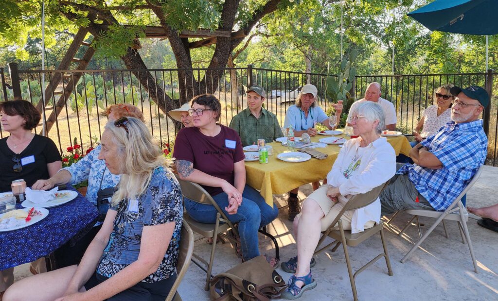 Rapt attendees hearing announcements. L. Burk.