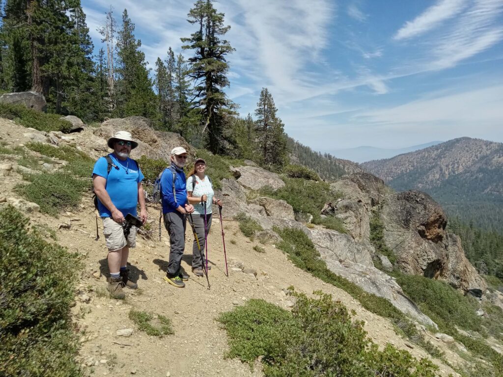 Three hikers on upper trail. D. Ledger.