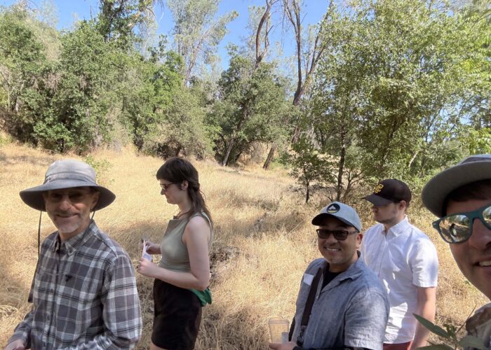 Jeremey catches Doug Mandel and other attendees on the trail at the preserve. Photo by J. Kelley.