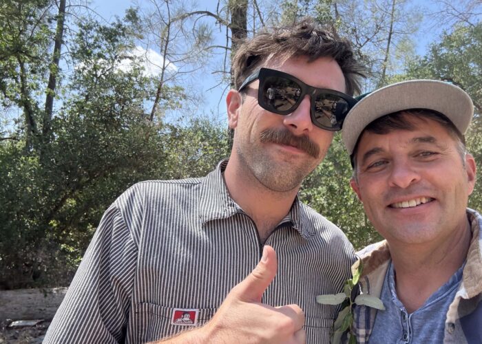 A picnic attendee gives a thumbs up in selfie with Jeremey. Photo by J. Kelley.