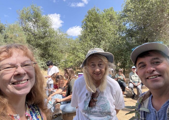 Jeremey takes a selfie with picnic-goers. Photo by J. Kelley.