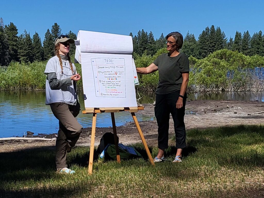 Heather Bortolussi and Juliet Malik present at Manzanita Lake for the nature journaling event. Photo © Doug Mandel.