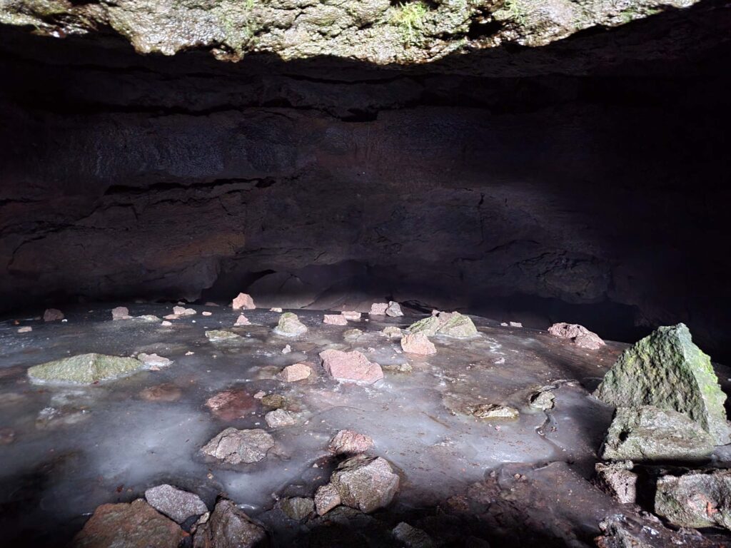Ice on the floor of a cave, observed on the August 2025 Sáttítla trip. Photo © D. Mandel.