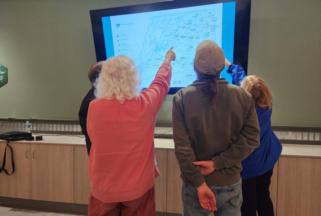 Checking out Tessa's map. L. Burk.