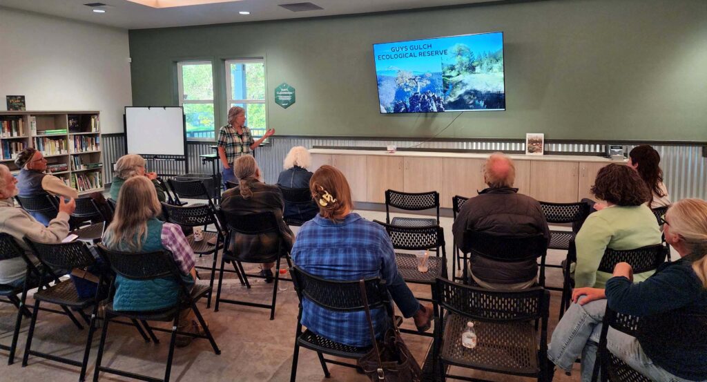 Kathleen Perillo speaking at the April 2026 Chapter meeting. D. Burk.